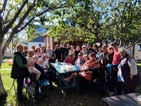 Big get-together in a garden under the trees