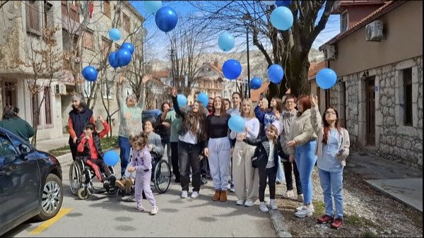 Blue balloon event on a street in Cetinje